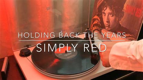 simply red holding back the years reaction
